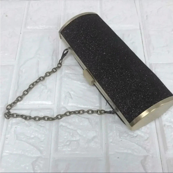 UNLISTED BLACK AND GOLD GLITTER OVAL CLUTCH WITH DETACHABLE CHAIN 8.5” x 3.5” - Picture 1 of 8